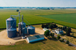 aerial photo of modern farm with silos