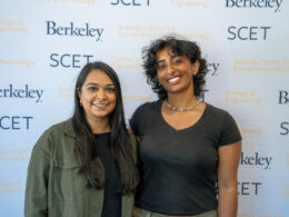 photo of Gurram and Patel in front of Berkeley SCET banner