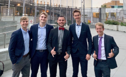 team members in front of UN building