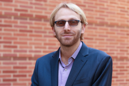 head and shoulders photo of professor Di Carlo in front of a brick wall