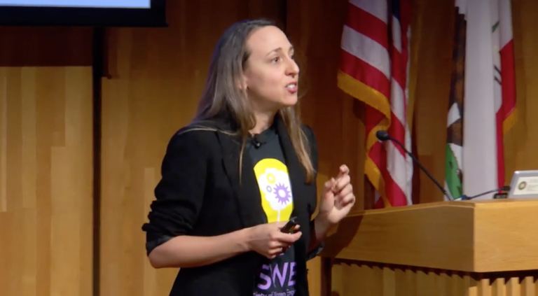 photo of Amy Herr speaking at podium