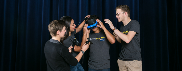 photo of students trying on VR headset