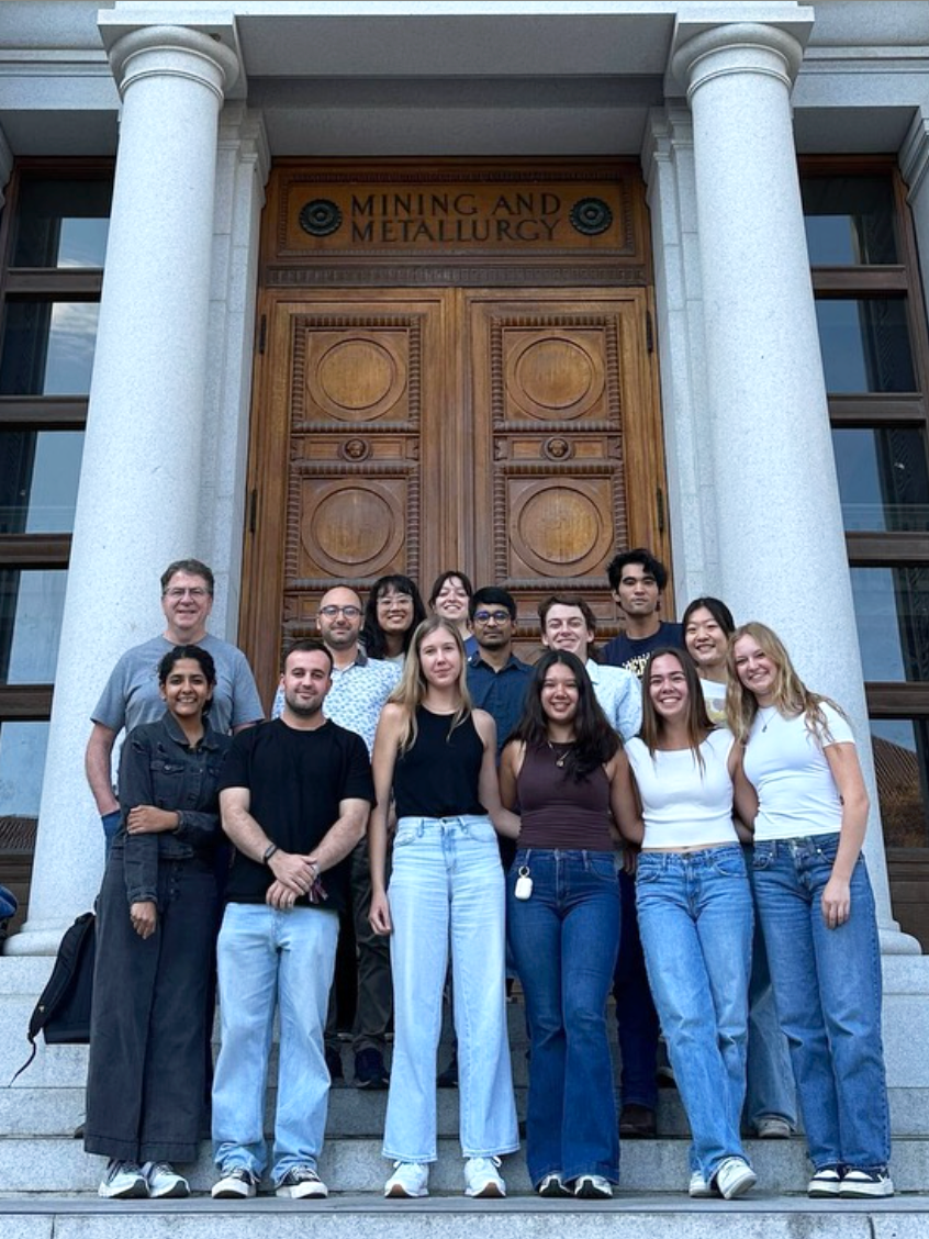 group photo of members of the Messersmith Lab in front of the doors to the Hearst Memorial Mining Building
